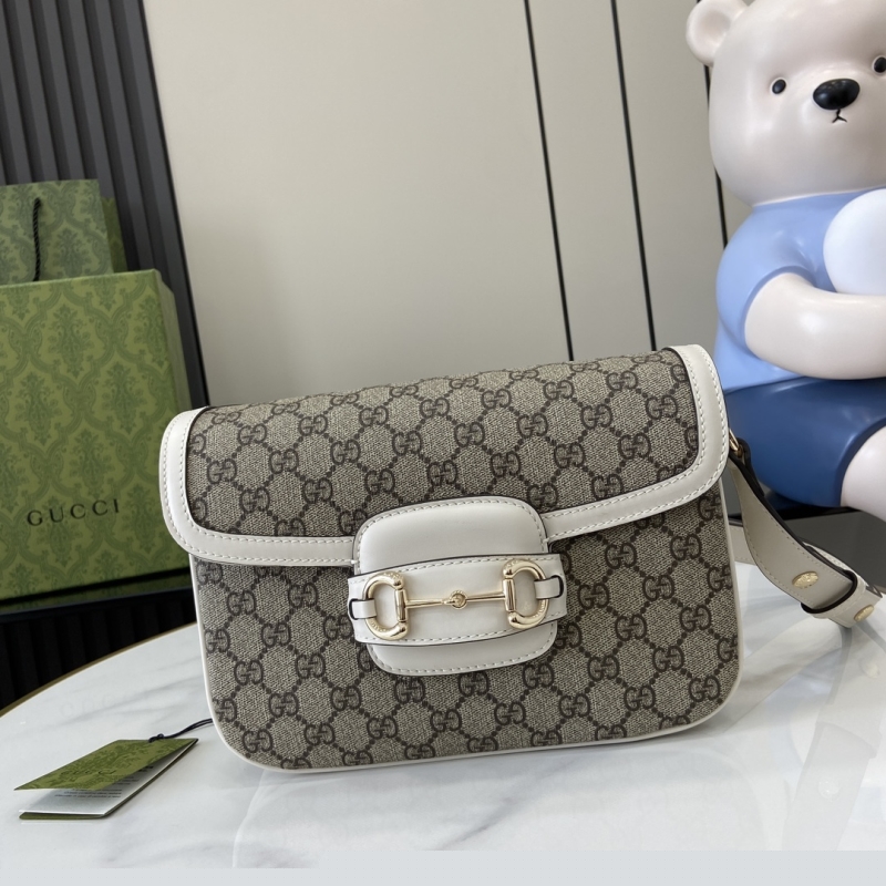 G*u*i clutch bags